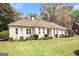 Attractive one-story home boasting an expansive lawn, refined landscaping, and a timeless facade at 110 Kylemore Pass, Tyrone, GA 30290