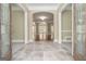 Spacious foyer with tiled floors, arched doorways, and elegant design at 110 Kylemore Pass, Tyrone, GA 30290