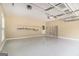 Clean, spacious two-car garage with epoxy floors, shelving, and an automatic door opener system at 110 Kylemore Pass, Tyrone, GA 30290