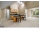 Kitchenette features a bar with seating and a sink, surrounded by a large bonus room at 110 Kylemore Pass, Tyrone, GA 30290