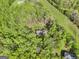 Idyllic aerial view of the home surrounded by lush greenery and open space at 140 Crimson Rdg, Tyrone, GA 30290