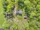 Aerial view of the property with lush greenery, house and additional shed at 140 Crimson Rdg, Tyrone, GA 30290