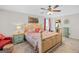 Another view of spacious bedroom, which shows the color scheme of the room, large windows, and ceiling fan at 140 Crimson Rdg, Tyrone, GA 30290