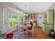 Bright breakfast nook with hardwood floors, large windows overlooking backyard, and built-in shelving at 140 Crimson Rdg, Tyrone, GA 30290