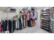 Spacious walk-in closet with multiple racks and shelves for organized storage of clothes and shoes at 140 Crimson Rdg, Tyrone, GA 30290