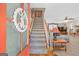 Welcoming foyer with a staircase, hardwood floors, and a glimpse into the living area at 140 Crimson Rdg, Tyrone, GA 30290