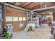View of the garage filled with storage, shelving, and a workbench at 140 Crimson Rdg, Tyrone, GA 30290
