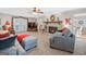 Spacious living room with a fireplace, comfortable seating, and ample natural light at 140 Crimson Rdg, Tyrone, GA 30290
