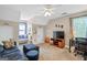 Cozy living room features vaulted ceilings, neutral walls, carpet floors, and lots of natural light at 140 Crimson Rdg, Tyrone, GA 30290