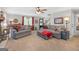 Comfortable living area with plush seating, a window view, and inviting decor at 140 Crimson Rdg, Tyrone, GA 30290