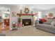 Living room featuring a stone fireplace and hearth, with decor and neutral color scheme at 140 Crimson Rdg, Tyrone, GA 30290