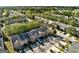 Scenic aerial view of a residential community with lush green trees and well-manicured lawns at 11419 South Grove Dr, Hampton, GA 30228