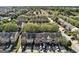 Scenic aerial view of a residential community with lush green trees and well-manicured lawns at 11419 South Grove Dr, Hampton, GA 30228