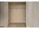 Spacious closet with a single shelf and tile floor, perfect for easy organization and storage solutions at 11419 South Grove Dr, Hampton, GA 30228