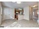 Open dining area flowing into kitchen with white cabinets, a breakfast bar, and a seamless flow for modern living at 11419 South Grove Dr, Hampton, GA 30228