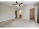 Spacious main bedroom showing walk-in closet and ensuite bathroom at 11419 South Grove Dr, Hampton, GA 30228