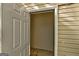 View into outdoor storage space on patio with white door and siding at 11419 South Grove Dr, Hampton, GA 30228