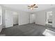 Large bedroom boasts neutral carpet, walk-in closet, and an en-suite bathroom at 653 Locust Rd, Locust Grove, GA 30248