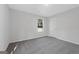 Cozy bedroom with neutral carpet, natural light, and a minimalist design at 653 Locust Rd, Locust Grove, GA 30248