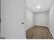 Hallway featuring two closets and hard surface flooring at 653 Locust Rd, Locust Grove, GA 30248
