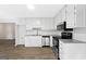 Kitchen with stainless steel appliances and stone countertops at 653 Locust Rd, Locust Grove, GA 30248