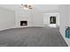 Spacious living room with fireplace, ceiling fan and sliding doors at 653 Locust Rd, Locust Grove, GA 30248