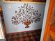 This home features a wall decoration and dark wood floors at 120 South Ave, Jonesboro, GA 30236