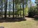 Tranquil scene of a lush backyard with mature trees, offering shade and privacy for a serene homesite at 183 Busbin Rd, Fayetteville, GA 30215