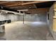 Large unfinished basement with concrete walls and floors, suitable for storage at 183 Busbin Rd, Fayetteville, GA 30215