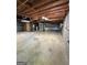 Unfinished basement showcases exposed ceiling beams, concrete walls, and a large open layout at 183 Busbin Rd, Fayetteville, GA 30215