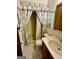 Cozy bathroom with shower, toilet, sink and neutral decor at 183 Busbin Rd, Fayetteville, GA 30215