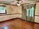 Bedroom featuring hardwood flooring, neutral paint, and large window at 183 Busbin Rd, Fayetteville, GA 30215