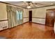 Bright bedroom with hardwood floors, neutral paint, and window at 183 Busbin Rd, Fayetteville, GA 30215