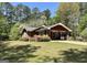 Beautiful single-Gathering home with a well-maintained lawn, mature landscaping, and a welcoming facade at 183 Busbin Rd, Fayetteville, GA 30215
