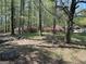 Scenic view of a beautiful homesite featuring mature trees and colorful azaleas at 183 Busbin Rd, Fayetteville, GA 30215