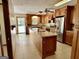 Well-lit kitchen featuring wooden cabinets, stainless steel appliances, and a functional island at 183 Busbin Rd, Fayetteville, GA 30215