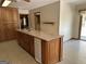 Bright kitchen featuring a center island, tile floors, and a ceiling fan at 183 Busbin Rd, Fayetteville, GA 30215