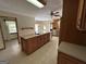Open kitchen with a large center island, and tile flooring, offering ample workspace at 183 Busbin Rd, Fayetteville, GA 30215