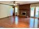 Open living area with hardwood floors, brick fireplace and access to the deck at 183 Busbin Rd, Fayetteville, GA 30215