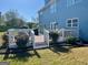 Exterior view featuring a wooden deck with white railing, perfect for outdoor enjoyment and relaxation at 1600 Prospect Pl, Locust Grove, GA 30248