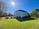 Sprawling backyard featuring level areas for playing and entertaining at 1600 Prospect Pl, Locust Grove, GA 30248