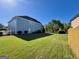 Backyard features level grassy areas and partial fencing at 1600 Prospect Pl, Locust Grove, GA 30248