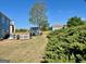Backyard featuring level areas, white deck, and a storage building at 1600 Prospect Pl, Locust Grove, GA 30248