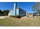 A light blue two-story house with a large backyard and a white wooden deck, perfect for outdoor relaxation at 1600 Prospect Pl, Locust Grove, GA 30248