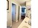 Bathroom with double sinks, tile floor, and neutral colors at 1600 Prospect Pl, Locust Grove, GA 30248