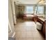 Spacious bathroom featuring a glass shower, white tub and tile flooring with double vanity at 1600 Prospect Pl, Locust Grove, GA 30248