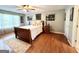 Bright bedroom with hardwood floors, neutral walls, and ceiling fan at 1600 Prospect Pl, Locust Grove, GA 30248