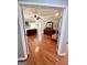 Large bedroom with hardwood floors, tray ceiling, and sitting area at 1600 Prospect Pl, Locust Grove, GA 30248