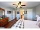 Bright bedroom with hardwood floors and a large window at 1600 Prospect Pl, Locust Grove, GA 30248