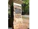 Stone pillar with the HB Parkwood sign on a green lawn near the road at 1600 Prospect Pl, Locust Grove, GA 30248